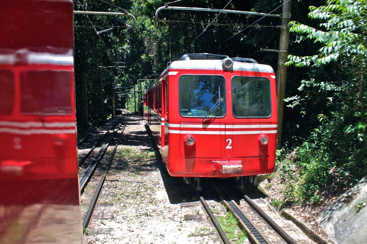 Red Corcovado train going up the mountain